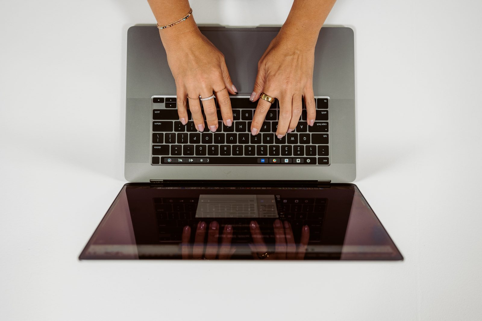Tamra typing on a laptop