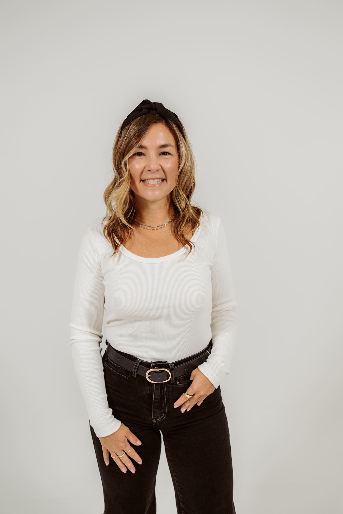 Tamra Fisher smiling in a studio portrait
